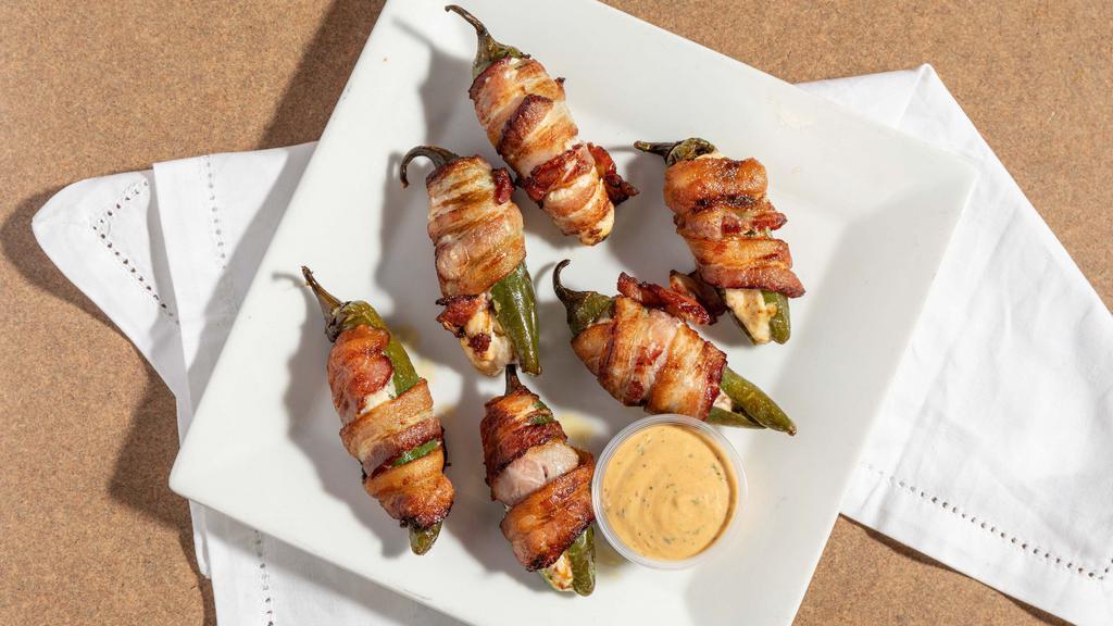 Torito Poppers · Bacon wrapped jalapeños stuffed with cream cheese and dried cranberry