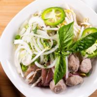 Phở Đặc Biệt - (Special Pho Bowl ) · Rice noodle soup with rare lean beef, well done flank, brisket, soft tendon, tripe and beef ...