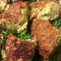 Falafel Salad · cucumbers, lettuce, green peppers, tomatoes, parsley and dressing topped with falafel