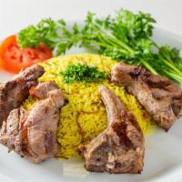 Lamb Chops Plate · 4 pieces of grilled lamb chops marinated in special spices. comes with salad and rice.