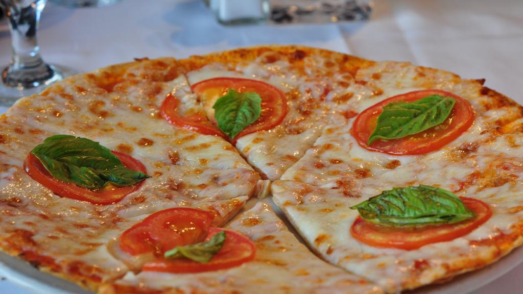 Pizza Doppia · Home-made thin pizza crust topped with your choice of meat-sauce or margherita style.