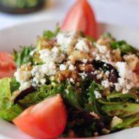 Mediterranean · Baby greens with vinaigrette and tomato, topped with walnuts and Gorgonzola cheese.