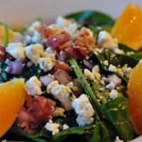 Giotto · Spinach salad with pancetta, red onions, fresh oranges, Gorgonzola cheese and vinaigrette.