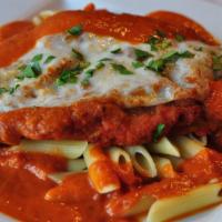 Pollo Parmigiana · Lightly battered chicken breast baked with basil, mozzarella and parmesan cheese and tomato ...