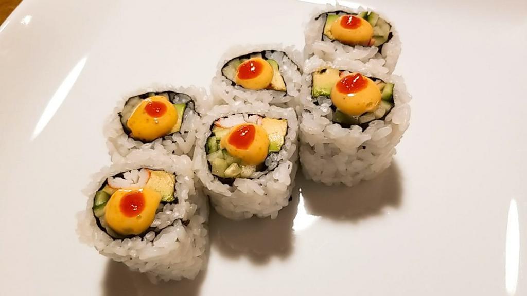 Spicy California Roll · Rolled with avocado, cucumber, crab and spicy sauce on top. 

Consuming raw fish may increase the risk of foodborne illness.