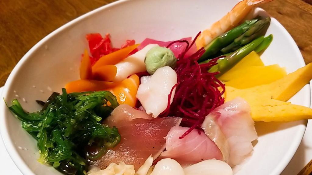 Chirashi Sushi · Assorted raw fish and delicacies over sushi rice in a bowl.