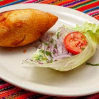 Papa Rellena · Potato croquette stuffed with meat, eggs, and raisins.  Served with salsa criolla.
