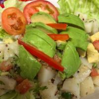 Quinoa Salad · Quinoa, avocado, cilantro, tomatoes, potatoes, lime with a house dressing.