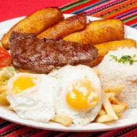 Bistec A Lo Pobre · 7 oz grilled beef tenderloin.  Served with fries, fried plantains, fries eggs, rice and salad.