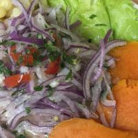 Ceviche · Tilapia cured in lime juice, garlic, red onion, celery. Served with corn, sweet potato and p...
