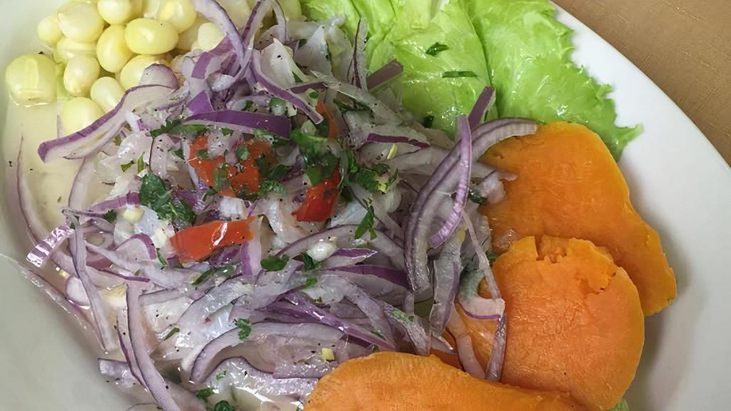 Ceviche · Tilapia cured in lime juice, garlic, red onion, celery. Served with corn, sweet potato and potato.