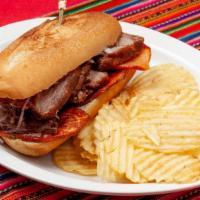Chicharron · Fried pork tenderloin. Served on bread with fried sweet potatoes salsa criolla.