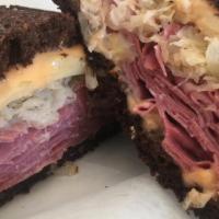 Reuben · Corned beef, Swiss, sauerkraut and 1000 island dressing served hot on dark rye.