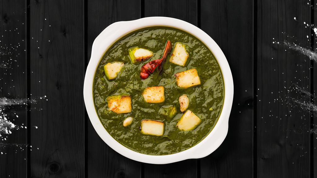 Pureed Spinach Cottage Cheese · Indian cottage cheese cubes in a smooth spinach sauce, fresh spinach leaves, paneer (firm cottage cheese), onions, tomatoes, herbs, and spices served with a rice