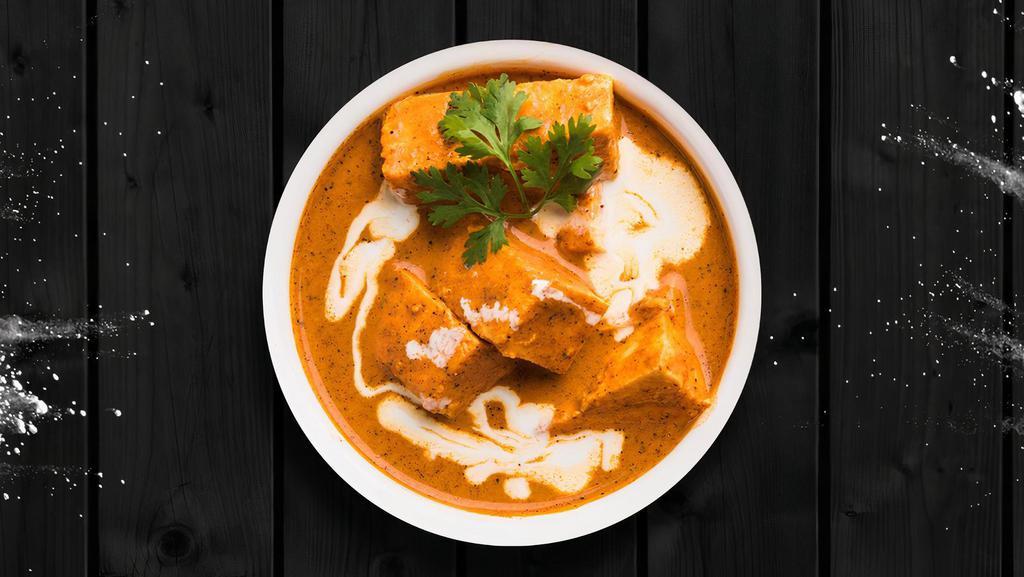 Chargrilled Cottage Cheese Curry · Cubed homemade cottage cheese with diced onions and peppers simmered in a rich creamy tomato sauce served with a rice