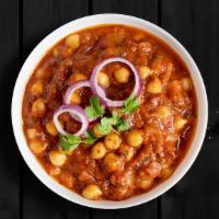 Spiced Chickpea Curry  · Chickpeas cooked with juicy onions, tomatoes, and perfectly grounded spices served with a rice