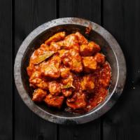 Chicken Tikka Madness · Chargrilled chicken morsels slow-cooked in a rich onion and tomato gravy with generous amoun...