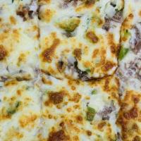 Philly Steak Pizza · Philly Steak, Green Peppers & Onions with a Cajun Crust.