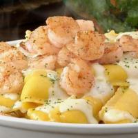 Shrimp Topped Over Meat Stuffed Ravioli · Stuffed Delicious Meat Ravioli Topped with Sautéed-Garlic-Buttered-Shrimp and Parmesan, serv...