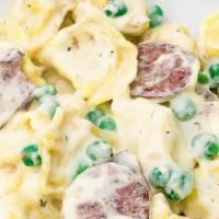 Italian Sausage Topped Meat Ravioli · Stuffed Meat Ravioli Topped with Tasty Italian Sausage and served with your favorite home-ma...