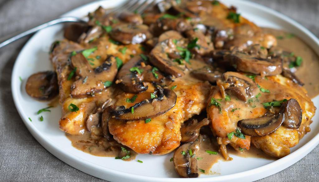 Chicken Marsala · Lightly floured chicken breasts topped with savory mushroom and marsala wine sauce, gently tossed in a rich and creamy sauce of Marsala wine, onion, lemon juice, and sliced mushrooms.