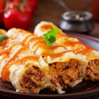 Cannelloni · Tube shaped pasta stuffed with ham, ground beef, and a creamy sauce, topped with marinara, m...