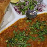 Pav Bhaji · Blend of spicy vegetables, served with toasted bread buns and raw onions/lime on the side