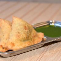 Samosa Plate (2 Pc) · Triangular pastry with a savory filling of spiced potatoes, peas, and lentils. Served with c...
