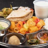 Special Gujarati Thali · 2 Daily special vegetables, 1 dal or kadhi, rice, 3 puri or 3 roti, raita, papad, pickle, 1 ...