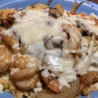 Fiesta Lunch · Bed of rice topped with grilled chicken + steak + shrimp + zucchini + tomato. Cheese sauce o...