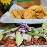 Ceviche · Fresh tilapia cured and marinated in lime juice. Served with pico de gallo, avocado. Served ...