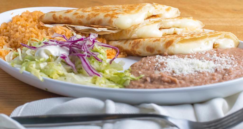 #2. Platter (Quesadilla) · Choose your favorite meat as the stuffing of a large and toasty flour tortilla filled with melted cheese. Served with rice, beans, lettuce and sour cream.