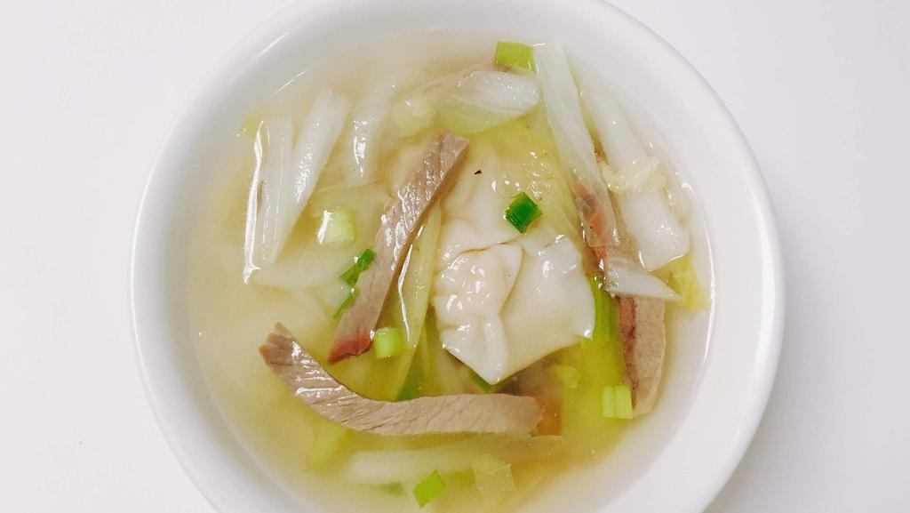 Roast Pork Wonton Soup · 5 pork filled wontons, roast pork strips, onions, cabbage and celery in a clear chicken broth.