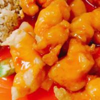 Sweet & Sour Chicken · Sweet and sour sauce comes on the side with green peppers and pineapples mixed in.
