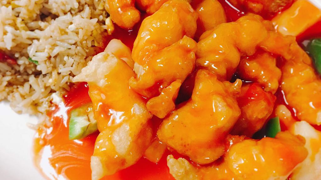 Sweet & Sour Chicken · Sweet and sour sauce comes on the side with green peppers and pineapples mixed in.