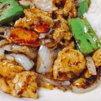 Black Pepper Chicken · Hot. White meat chicken, onions, carrots and green peppers in spicy black pepper sauce.