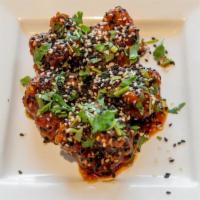 Sesame Gobi · Indo-Chinese. Cauliflower flowerets with honey, soy sauce, and topped with sesame seeds.