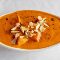 Chicken Makhni · Boneless chicken cooked in creamy tomato sauce, with, fenugreek leaves, cashews nut paste, a...