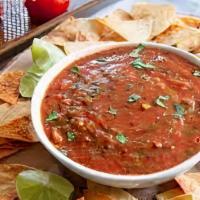 Chips & Roasted Salsa · Chef's special homemade salsa with roasted tomatoes, jalapeños, garlic, and cilantro - serve...
