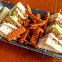 Turkey Club Sandwich · Freshly roasted turkey sliced layered with applewood smoked bacon, lettuce, tomato, and mayo.