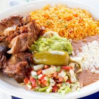 Carnitas · Fried seasoned pork chunks is one of Mexico's classics. Served with rice, beans, lettuce, gu...