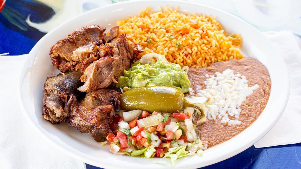 Carnitas · Fried seasoned pork chunks is one of Mexico's classics. Served with rice, beans, lettuce, guacamole, jalapeños, pico de gallo and tortillas.