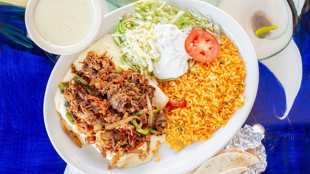 Enchiladas Rancheras · Three cheese enchiladas, cover with pork, cooked with tomatoes, onions, and green peppers, topped with cheese sauce. Served with rice, lettuce, tomato, and sour cream.