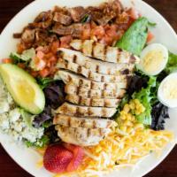 Cobb Salad · Grilled chicken breast served over crispy greens with Avocado, tomato, Corn, Bacon, Blue Che...
