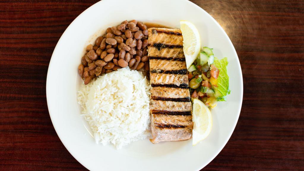 Grilled Salmon · Atlantic salmon with our seasoned with our special blend and grilled to perfection.