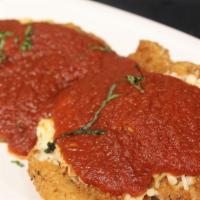 Chicken · Chicken parm is breaded, pan-fried and then baked with tomato Sauce and four cheeses served ...