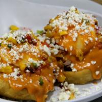 Sope Benedict · Classic Mexican sopes (homemade tortilla cakes) topped with slow cooked carnitas, fresh hous...