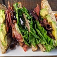Blt And Avocado Sandwich · Whole wheat toast loaded with crispy bacon, lettuce, tomatoes, mayonnaise, and avocado.