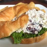 Chicken Harvest Croissant · Chicken salad with Granny Smith apples, celery, green onions, pecans and cranberries with le...