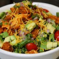 Buffalo Chicken Salad · Tender fried chicken dipped in buffalo sauce served on a bed of mixed greens with tomatoes, ...